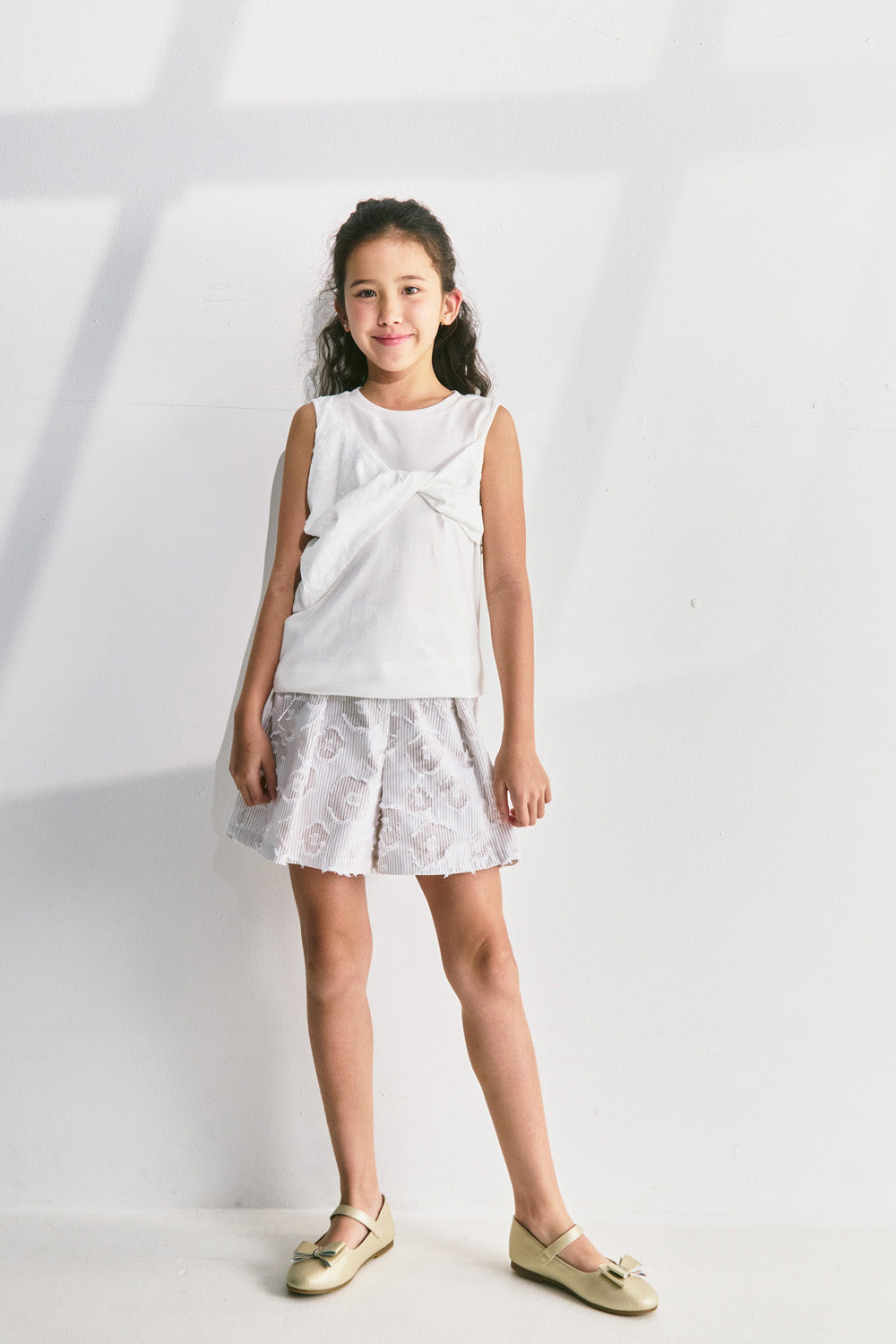 【予約商品】Luxury コレクション:Mini Fleur ツイストノースリーブトップス